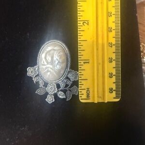 Vintage-Inspired Cream Cameo Brooch with Silver Floral Design
